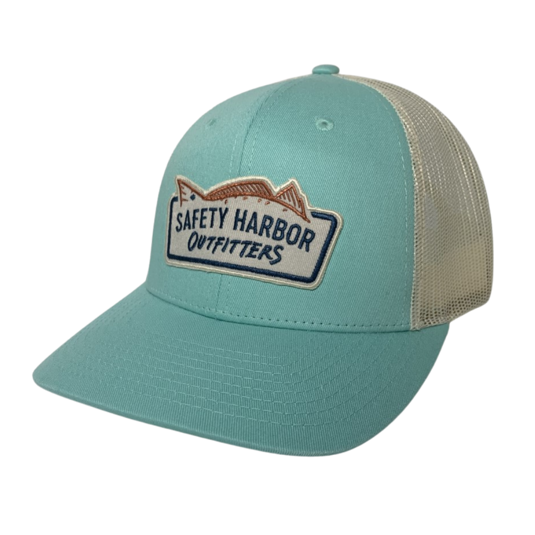 The Beachy Blues is a low profile structured trucker hat emblazoned with the Safety Harbor Outfitters logo. It's for the beach or any other time you are dreaming about the beach, instead of the bs that you're supposed to be doing. An all day, every day hat!